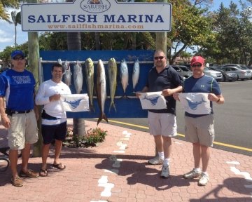 Men in front of the sailfish marina sign